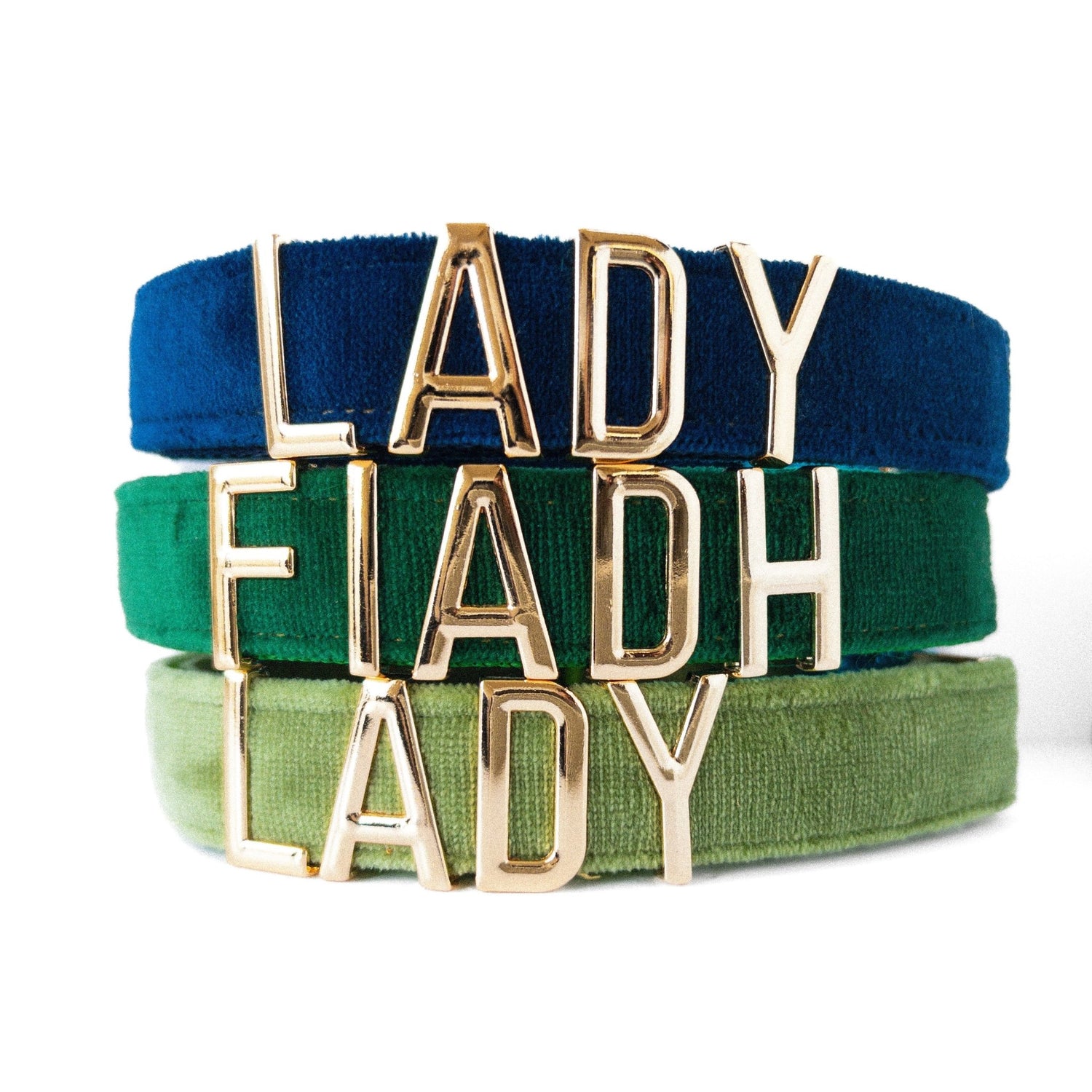 Custom metal letter dog collar collection featuring personalized nameplates in vibrant colors