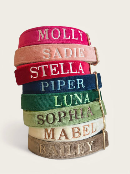 Collection of personalized embroidery dog collars in various colors with names beautifully stitched